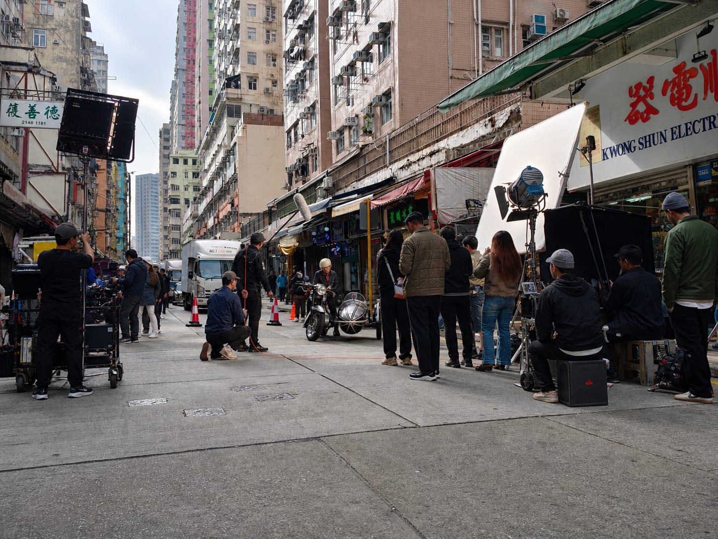 Hong Kong cinematographer setting up shots on set.
